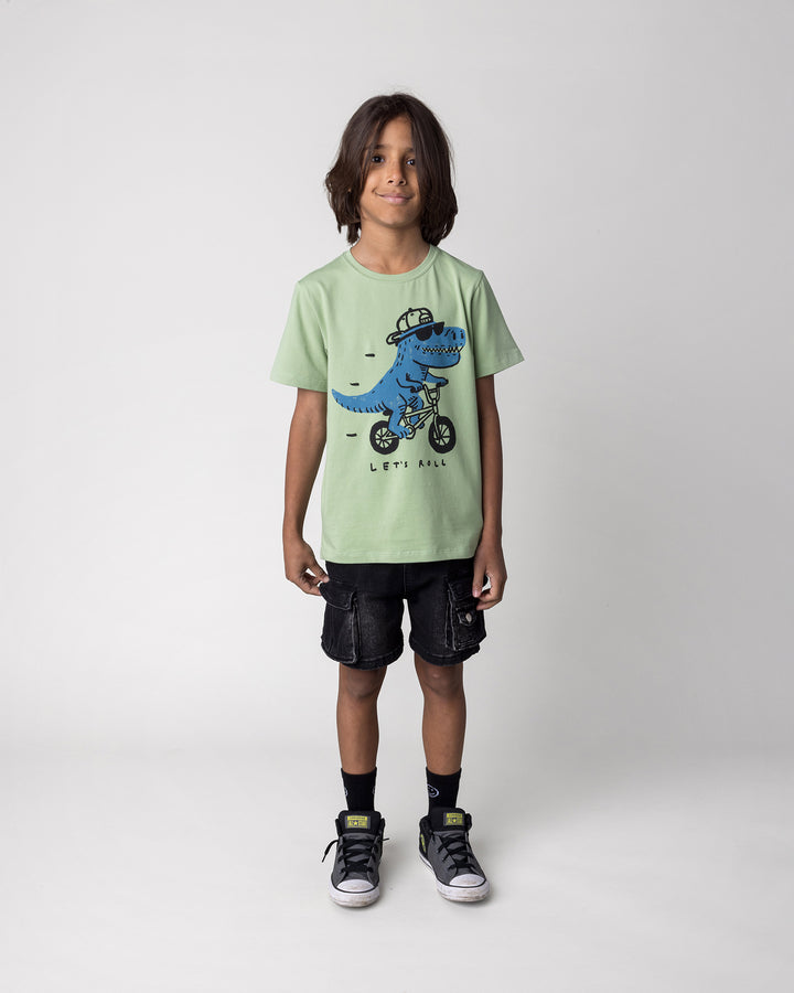 Kid wearing the Rex Rider Tee in sage, front view