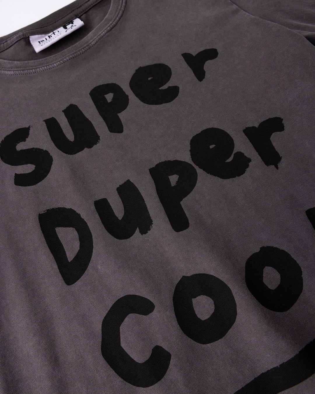 Close up of the Super Duper Cool Tee print in black wash