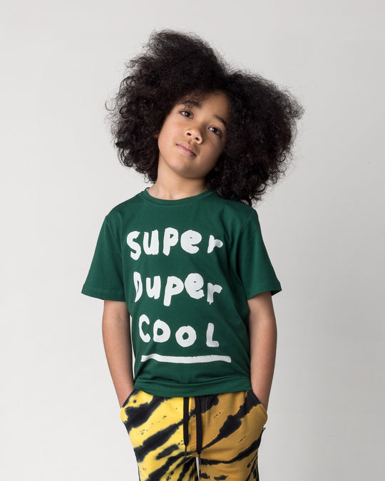 Close up of the Super Duper Cool Tee in jungle on a kid, front view