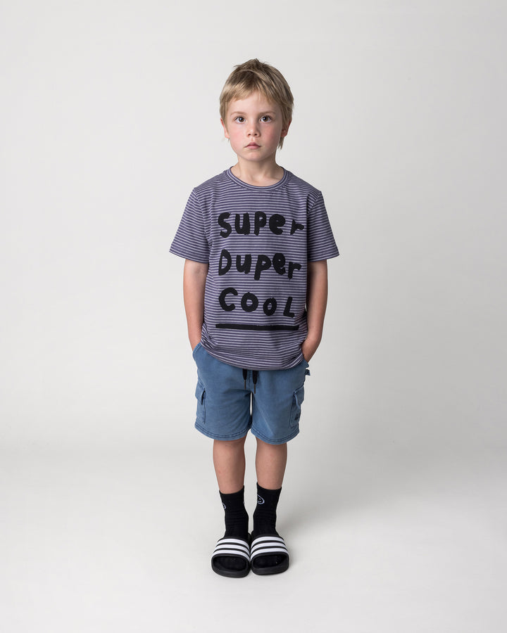 Kid wearing the Super Duper Cool Tee in storm stripe with the Blasted Deluxe Cargo Short in midnight wash, front view
