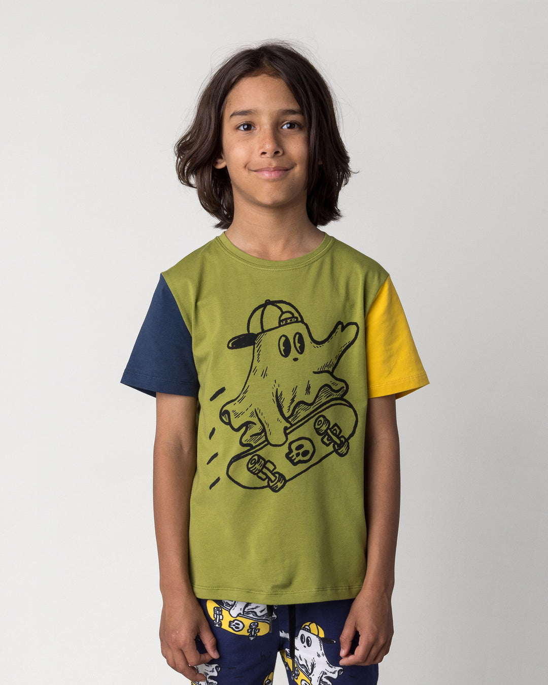 Close up of the Skate Ghost Tee in olive, ink and mustard on a kid, front view