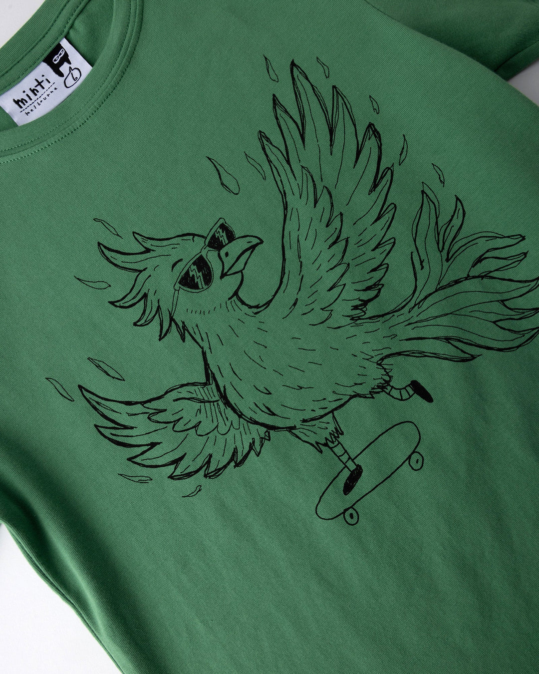 Close up of the Skate Phoenix Tee print in turf
