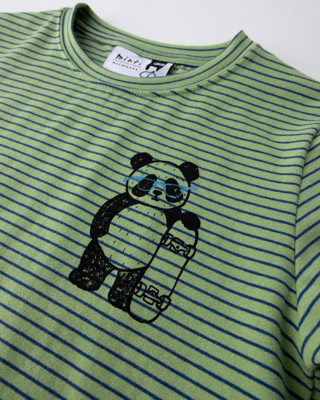 Close up of the Skate Panda Tee print in lime stripe