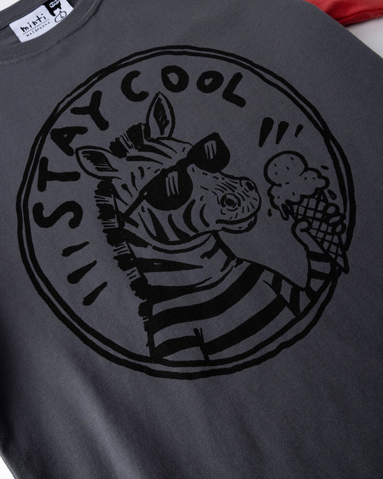 Close up of the Stay Cool Tee print in dark grey, yellow and melon