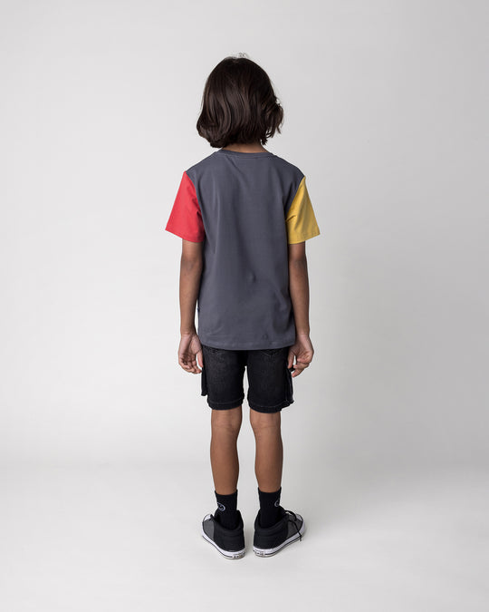 Kid wearing the Stay Cool Tee in dark grey, yellow and melon, back view