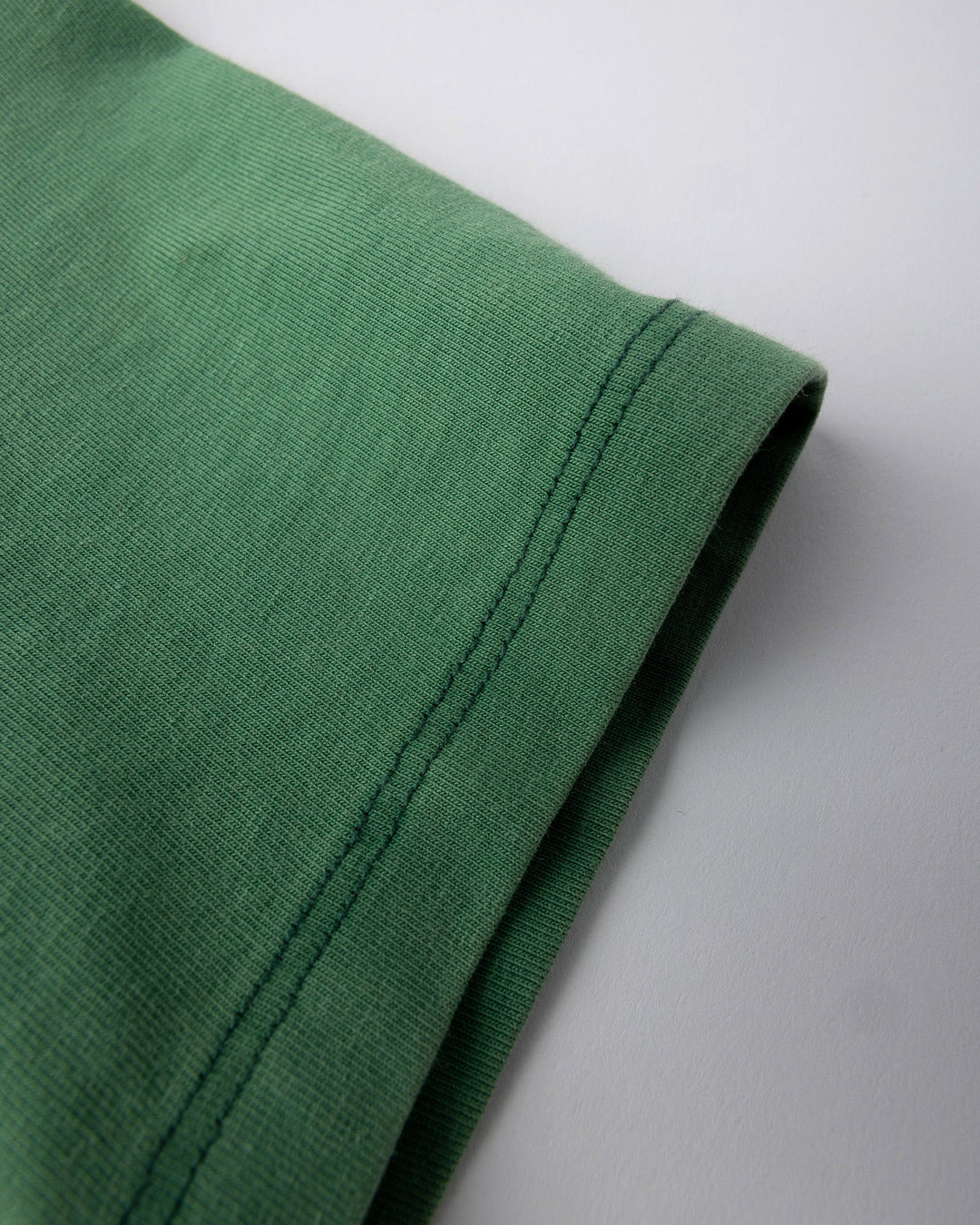 Close up detail of the Super Cool Tee in turf wash