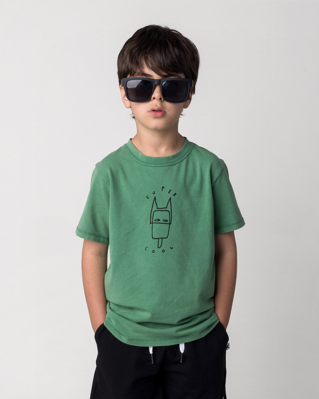 Close up of the Super Cool Tee in turf wash on a kid, front view