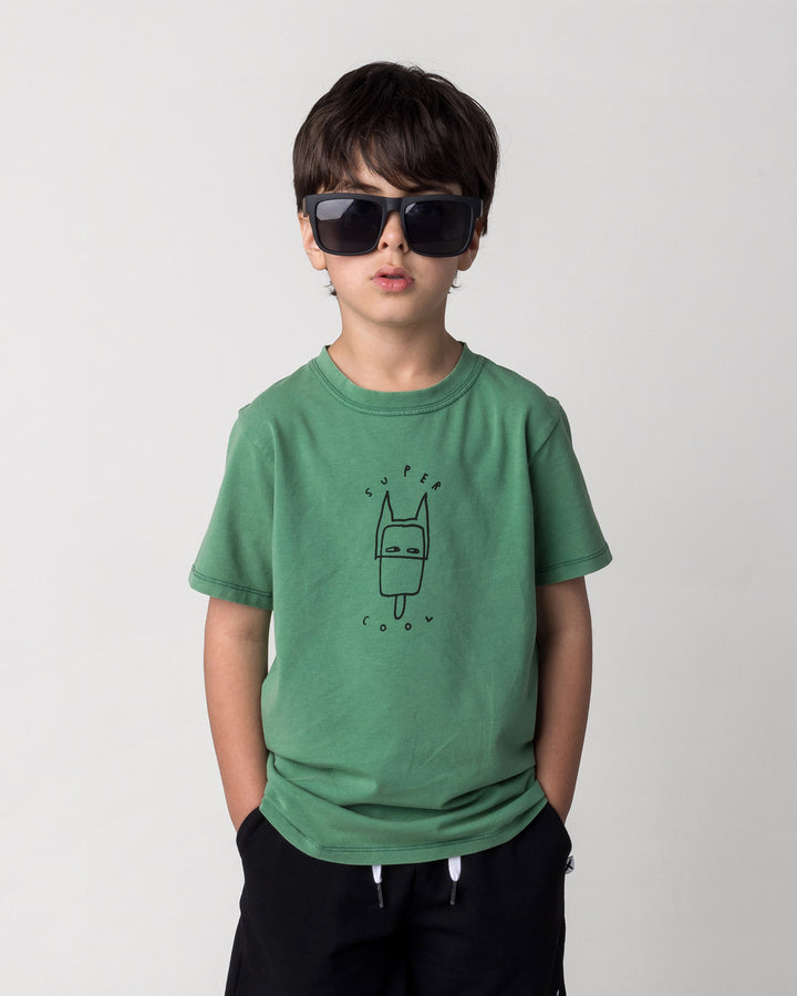 Close up of the Super Cool Tee in turf wash on a kid, front view