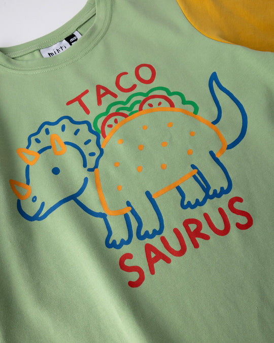 Close up of the Taco Saurus Tee print in sage, midnight and yellow