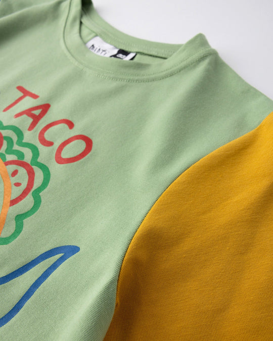 Close up detail of the Taco Saurus Tee in sage, midnight and yellow