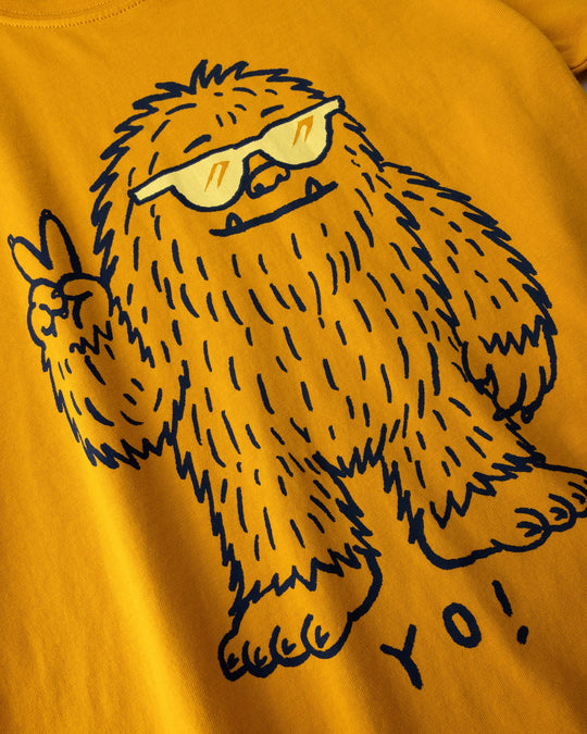 Close up of the Yo Yeti Tee print in mustard