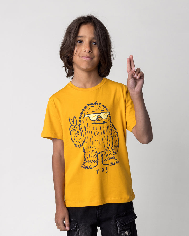 Close up of the Yo Yeti Tee in mustard on a kid, front view