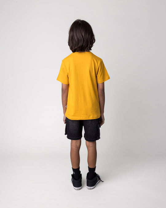 Kid wearing the Yo Yeti Tee in mustard, back view