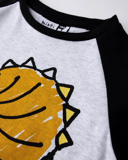 Close up of the Cool Dino Tee print in white marle and black