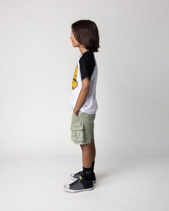 Kid wearing the Cool Dino Tee in white marle and black, side view
