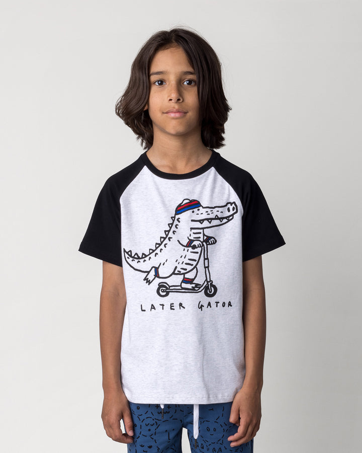 Close up of the Later Gator Tee in white marle and black on a kid, front view