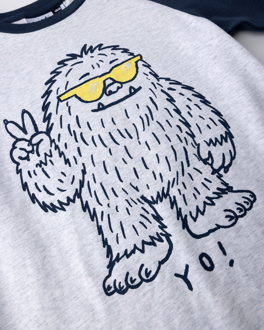 Close up of the Yo Yeti Tee print in white marle and ink