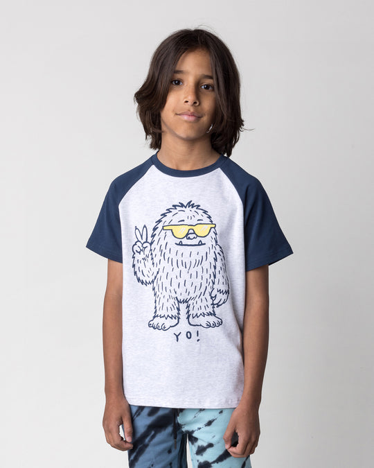 Close up of the Yo Yeti Tee in white marle and ink on a kid, front view