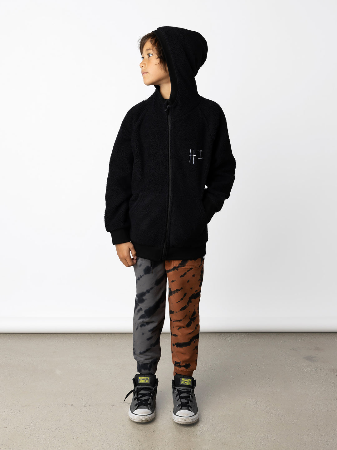 Minti kids clothing. Cosy zip through hoodie with kangaroo pockets for extra warmth! 2x2 rib trim on the hood, cuffs and hem. Small tonal Happy Face embroidery on the front. 330 Gram // Brushed Inside // 95% Cotton // 5% Elastane.