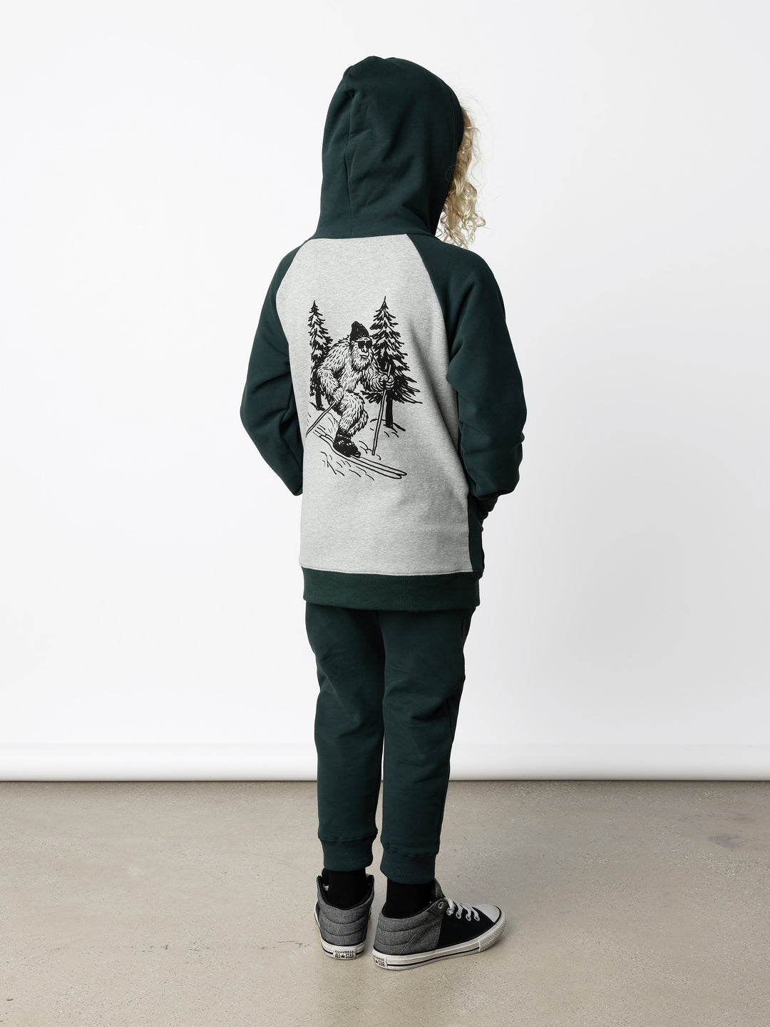 Minti kids clothing. Cosy zip through hoodie with kangaroo pockets for extra warmth! 2x2 rib trim on the hood, cuffs and hem. Small embroidery on the front and big print on the back. 330 Gram // Brushed Inside // 95% Cotton // 5% Elastane.
