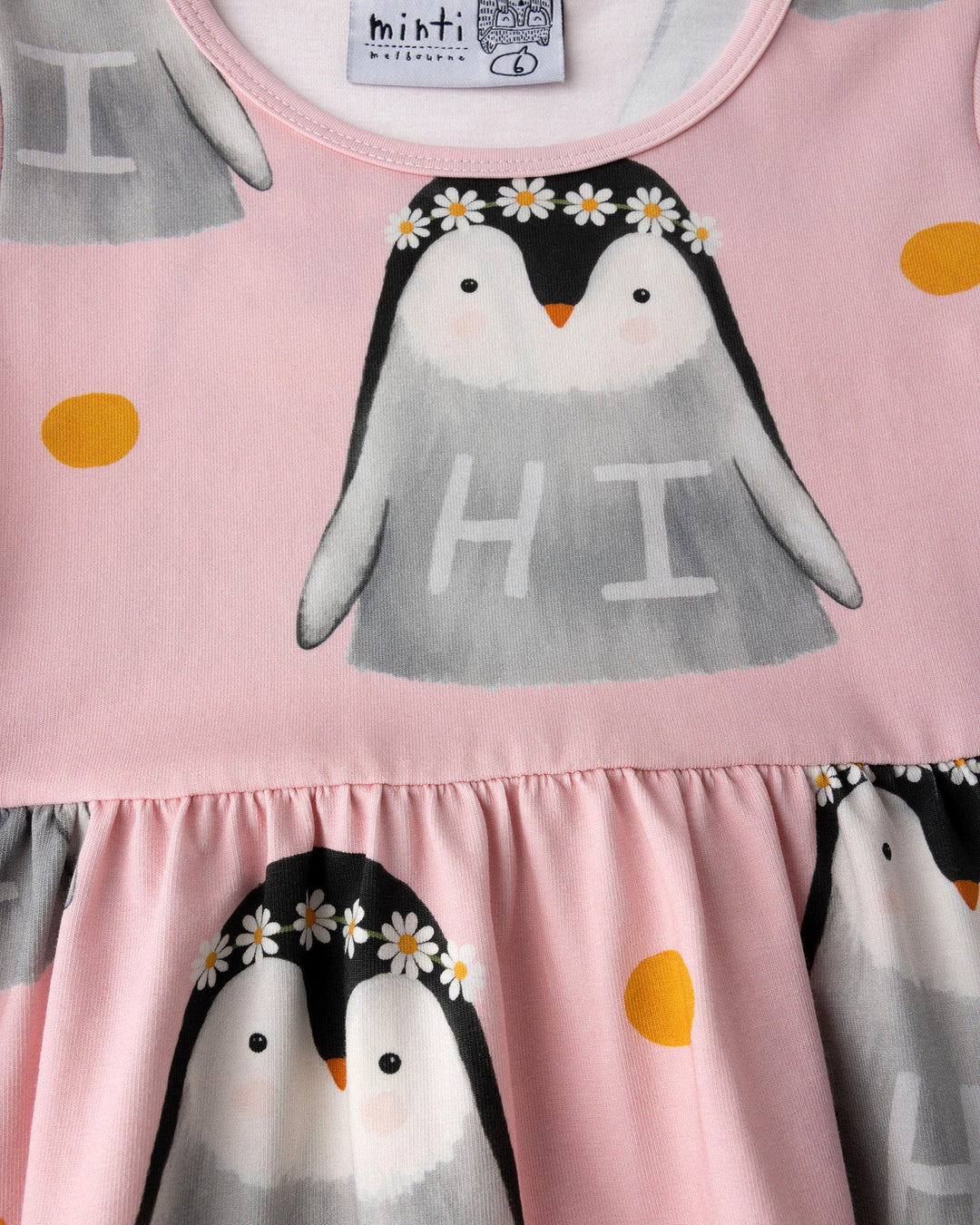 Close up of the Flower Penguin Dress print in pink