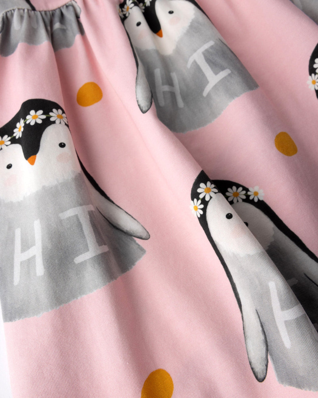 Close up of the Flower Penguin Dress print in pink