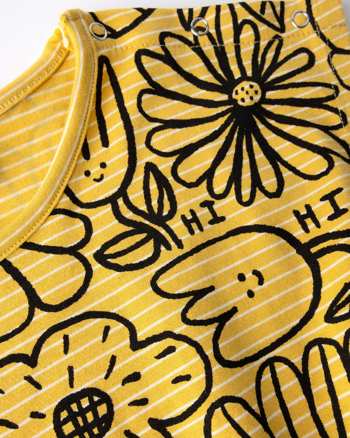 Close up of the Big Flowers Playsuit print in mustard stripe