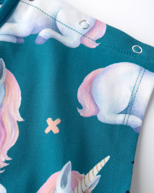 Close up of the Daydreaming Unicorn Playsuit print in teal