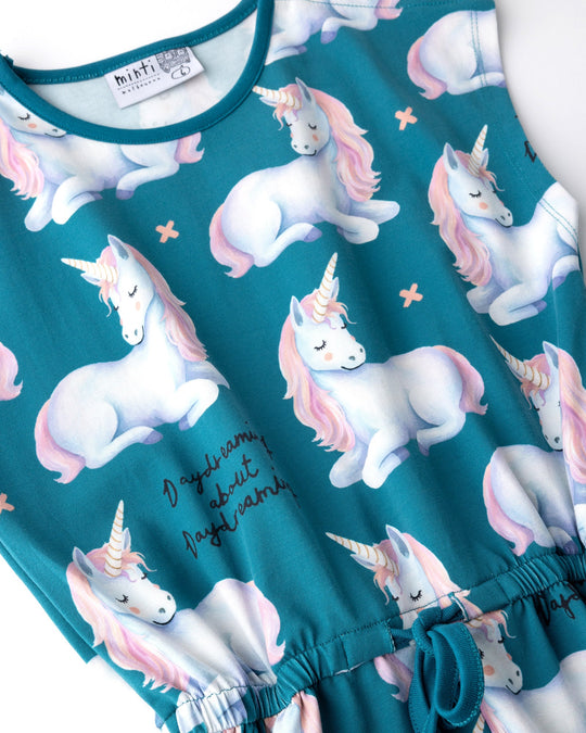 Close up of the Daydreaming Unicorn Playsuit print in teal