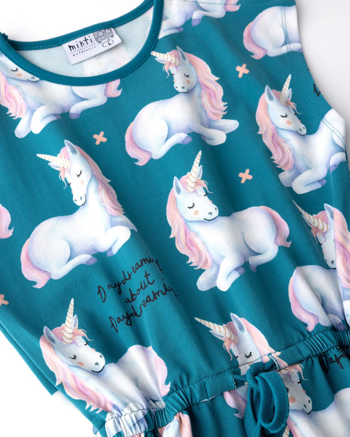 Close up of the Daydreaming Unicorn Playsuit print in teal