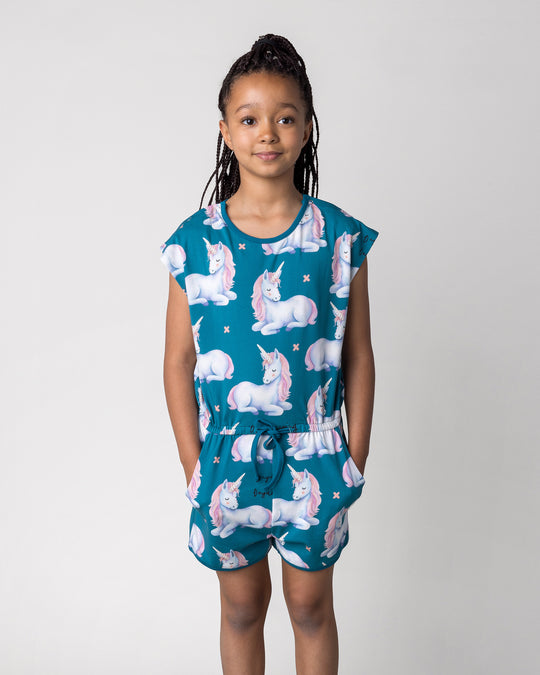 Close up of the Daydreaming Unicorn Playsuit in teal on a kid, front view