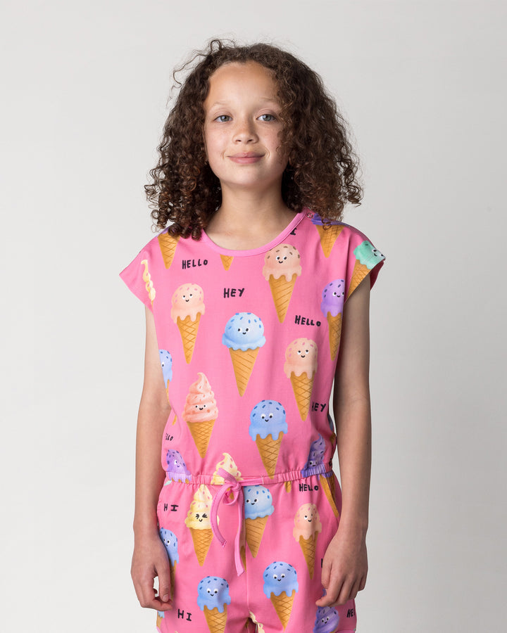 Close up of the Happy Icecreams Playsuit in pink on a kid, front view