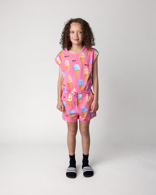 Kid wearing the Happy Icecreams Playsuit in pink, front view