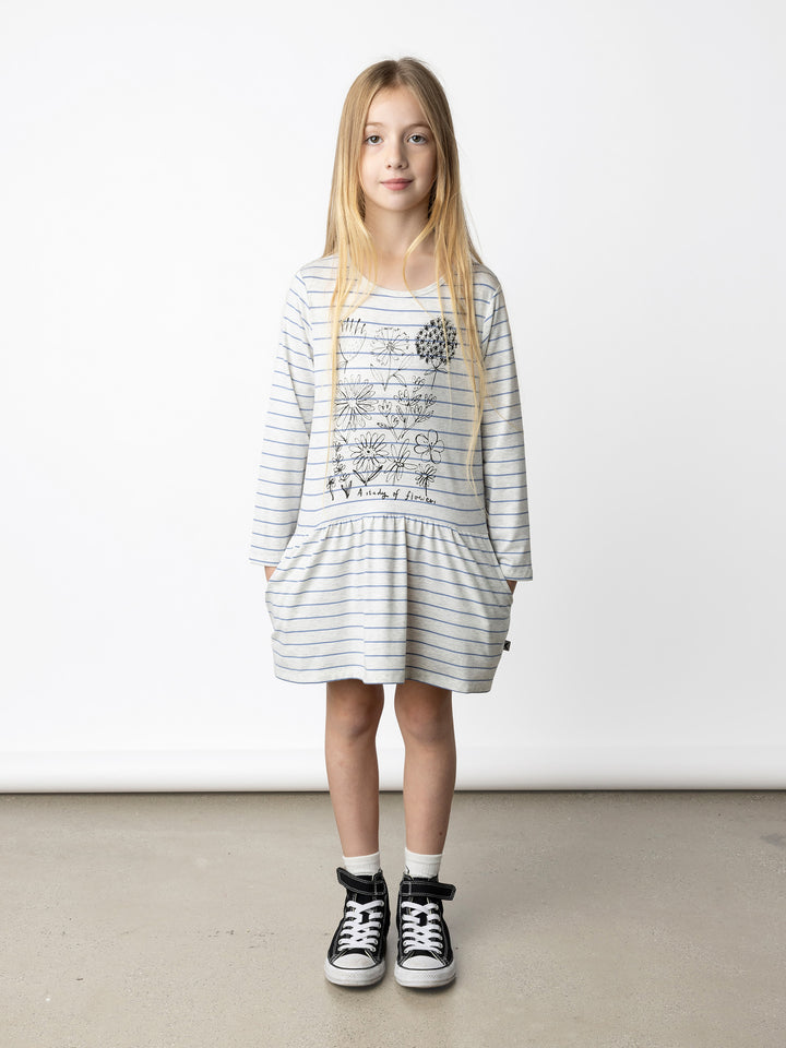Minti kids clothing. Comfy tshirting weight dress with ruched skirt seam, front pockets and scooped back hem. 180 Gram // 95% Cotton // 5% Elastane.
