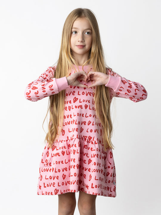 Minti kids clothing. Super cool sweatshirting weight dress with dropped skirt hem, pockets and ruching at the skirt seam. 320 Gram // 95% Cotton // 5% Elastane.