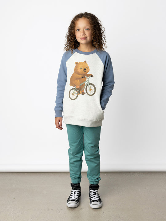 Minti kids clothing. Super comfy crew with rounded side pockets. 330 Gram // Brushed Inside // 95% Cotton // 5% Elastane.