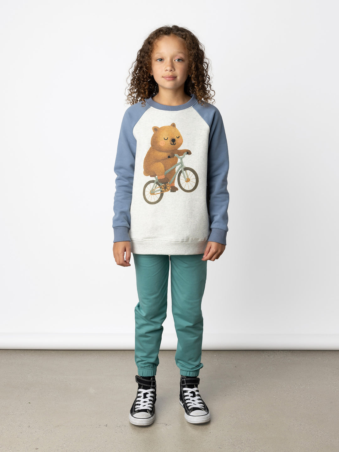 Minti kids clothing. Super comfy crew with rounded side pockets. 330 Gram // Brushed Inside // 95% Cotton // 5% Elastane.