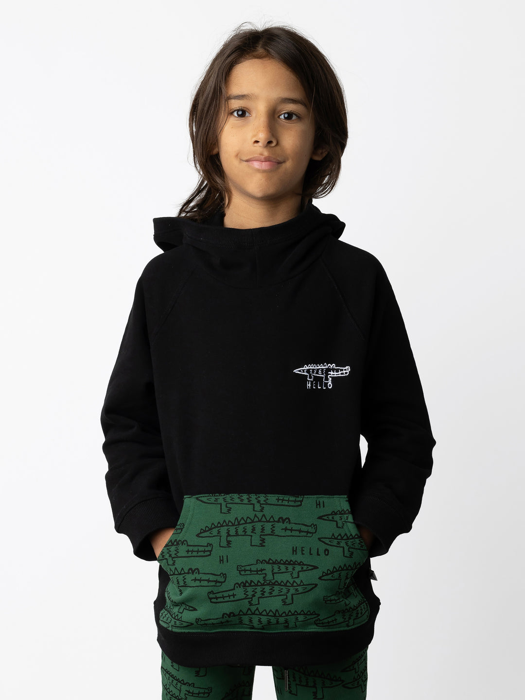 Minti kids clothing. Very comfy hoodie with raglan sleeves and contrast front kangaroo pocket. Small Hello Croc embroidery on the front. 330 Gram // Brushed Inside // 95% Cotton // 5% Elastane.
