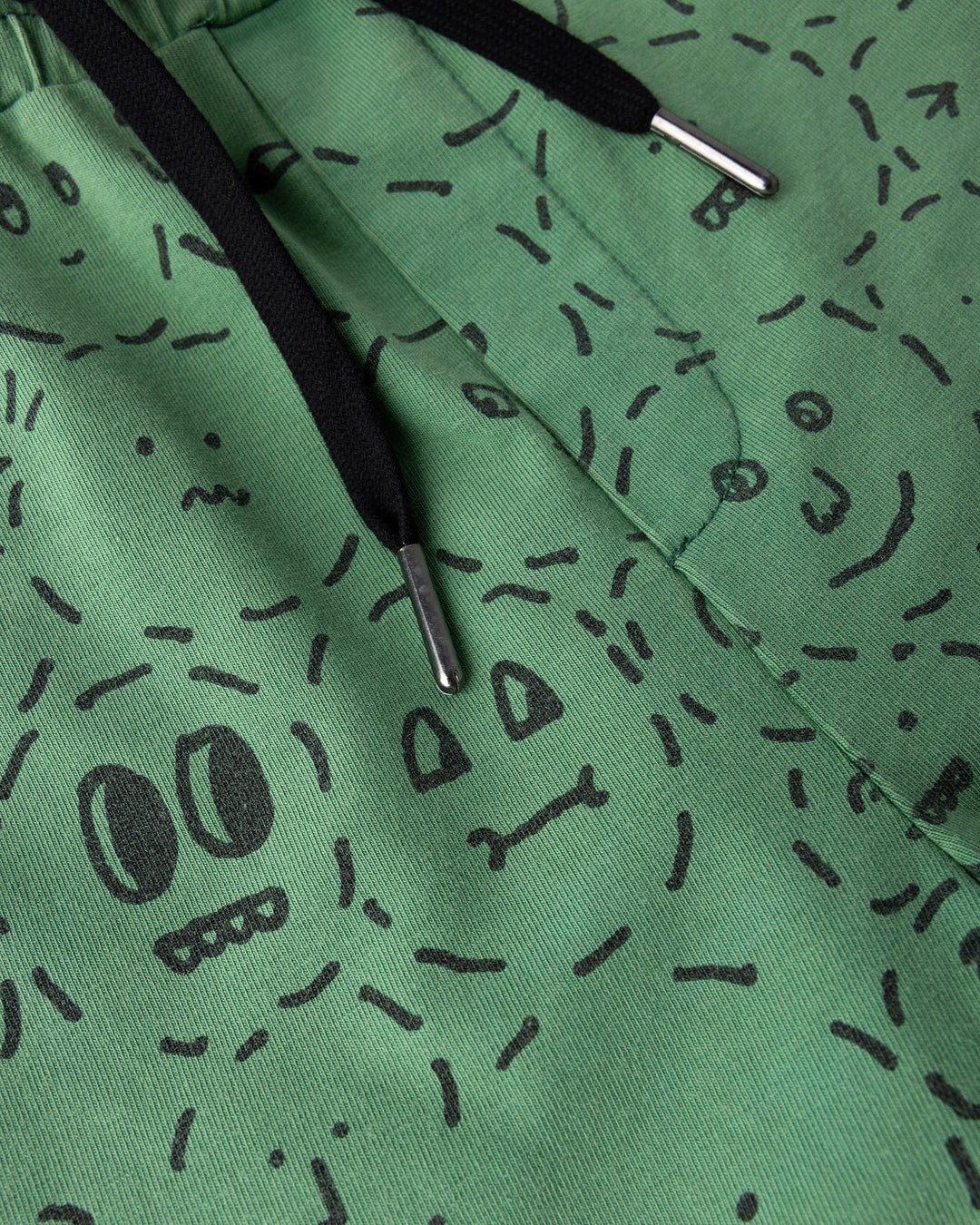 Close up detail of the Different Faces Short in turf wash