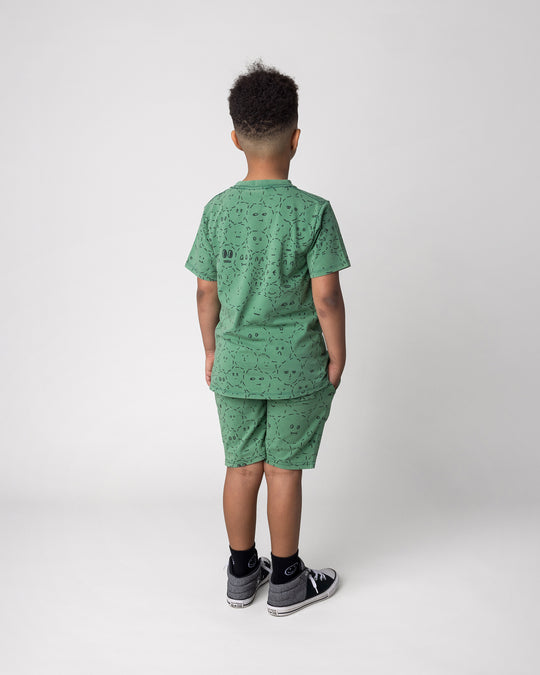 Kid wearing the Different Faces Short in turf wash with the Different Faces Tee in turf wash, back view