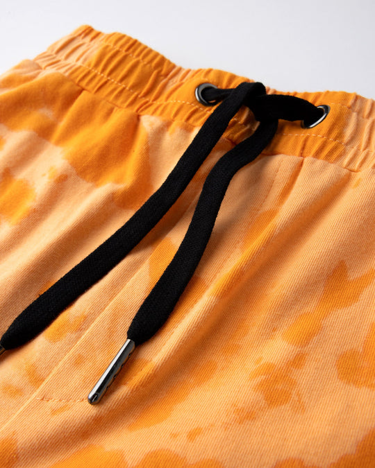 Close up detail of the Splatter Short in orange