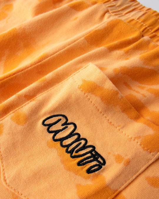 Close up detail of the Splatter Short in orange