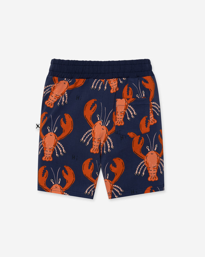 Vacay Crayfish Short in midnight, boys shorts by Minti, flat lay, back view