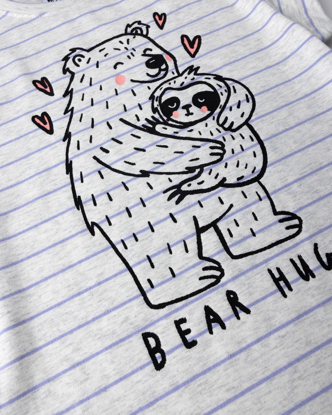 Close up of the Bear Hug Tee print in marle and purple stripe