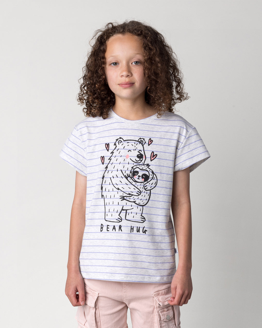 Close up of the Bear Hug Tee in marle and purple stripe on a kid, front view