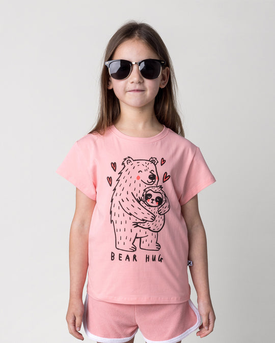 Close up of the Bear Hug Tee in pink on a kid, front view