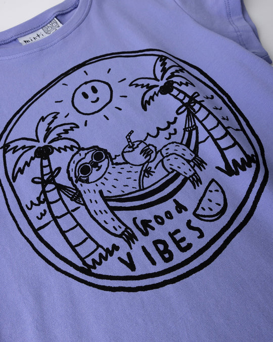 Close up of the Chill Sloth Tee print in purple