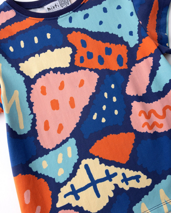 Close up of the Cool Shapes Tee print in dark blue