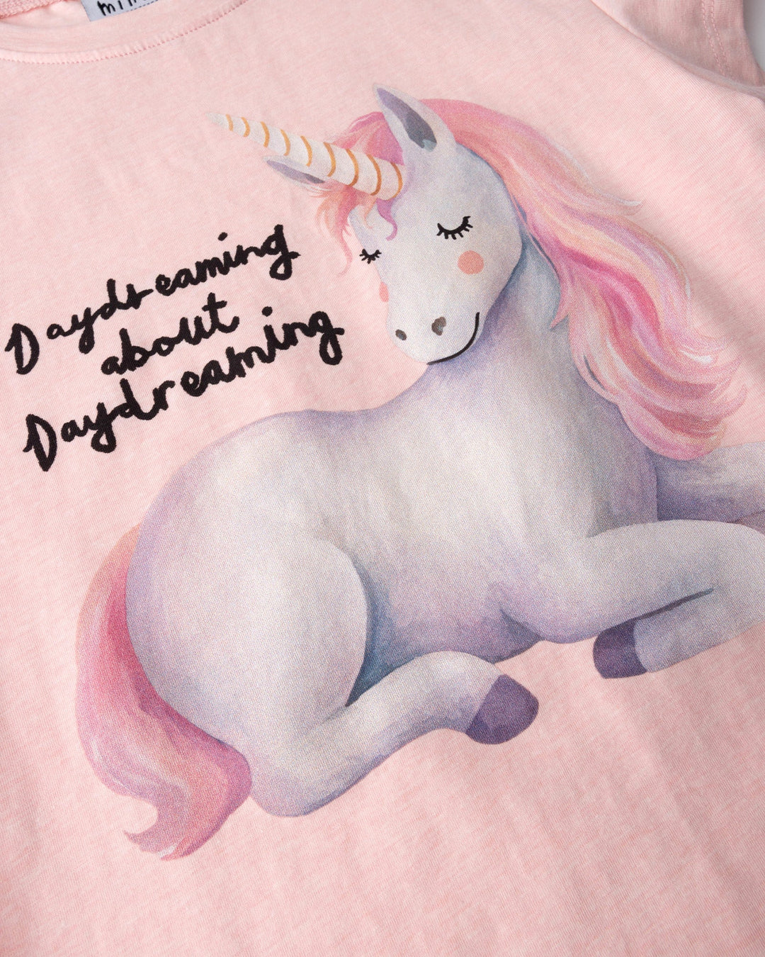 Close up of the Daydreaming Unicorn Tee print in pink marle