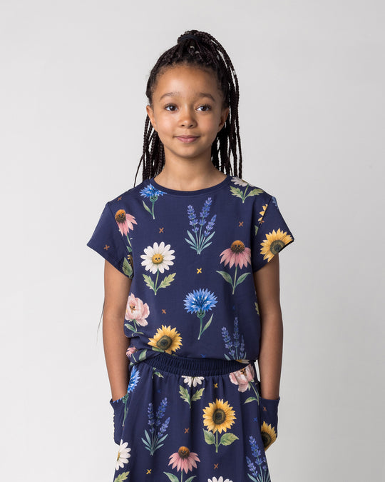 Close up of the Flower Friends Tee in ink on a kid, front view